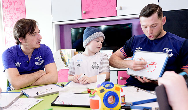 Leighton Baines joins an Everton in the Community play therapy workshop with young patients on one of the wards at Alder Hey.