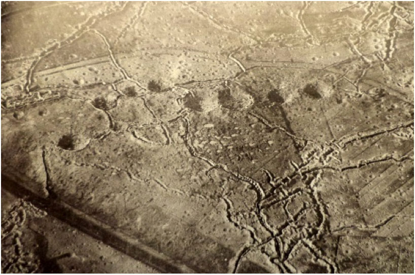 Hill 60 aerial view from the German side showing the mine craters, probably 1915. The feature in the bottom left of picture across the railway line is part of the feature called the Caterpillar (Imperial War Museum)