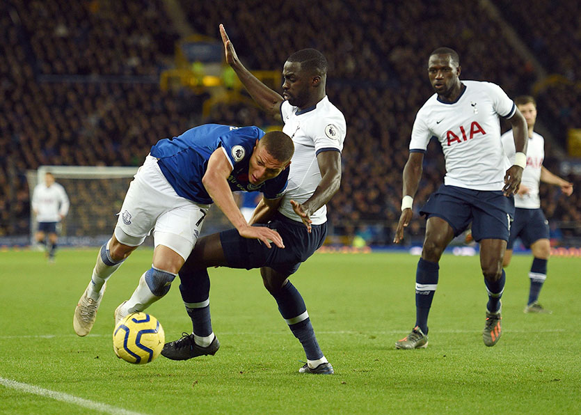 Richarlison is felled by Davinson Sanchez in the Tottenham area but no penalty was awarded