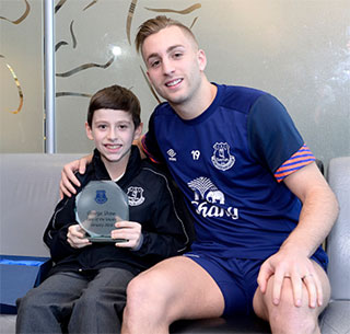 9-year-old George Shaw with Gerard Deulofeu